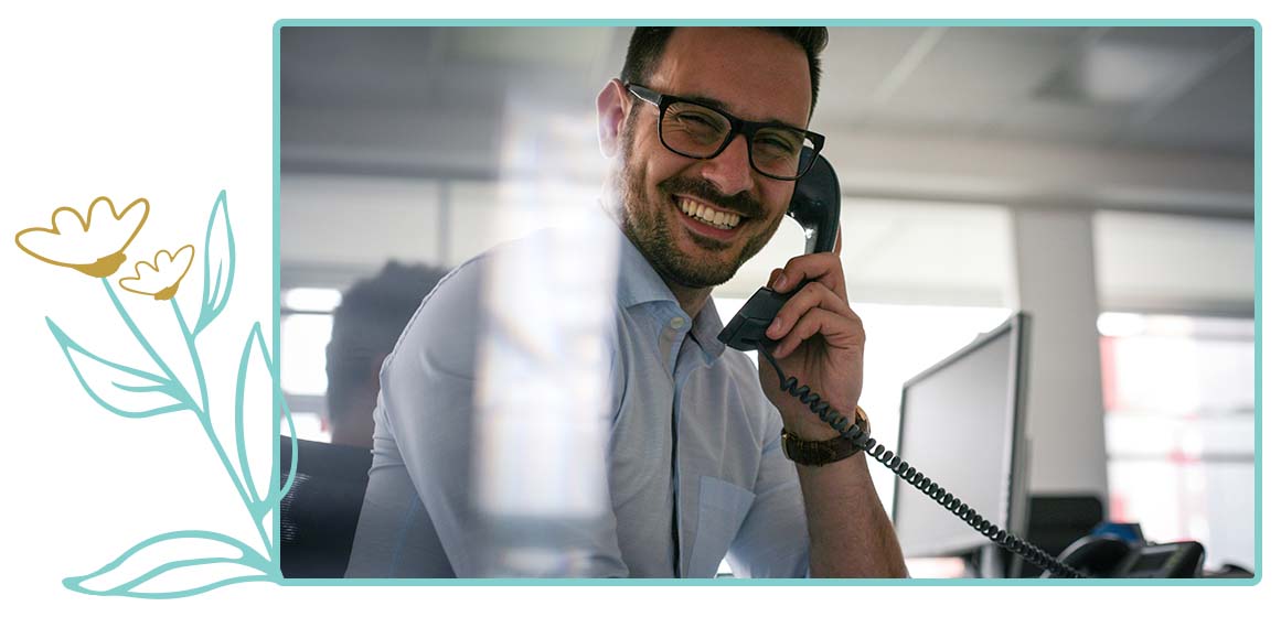 Smiling man speaking on phone